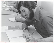 <span itemprop="name">An unidentified student taking notes during a...</span>