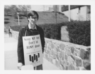 <span itemprop="name">An unidentified man participating in a picket line...</span>