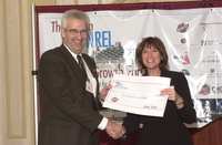 <span itemprop="name">Linda Trocki hands a check to an Billy Stanbery of...</span>