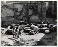 <span itemprop="name">Women washing clothes outside in stone basins,...</span>