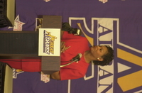 <span itemprop="name">Trina Thomas Patterson at the podium of a press...</span>