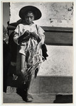 <span itemprop="name">A boy leaning at a building corner, wearing a hat,...</span>