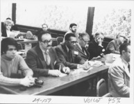 <span itemprop="name">Unidentified members seated at tables while...</span>