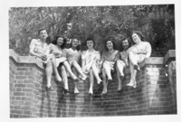 <span itemprop="name">A photograph of students sitting on a brick wall...</span>