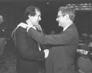<span itemprop="name">Tim Reilly shaking hands with an unidentified...</span>