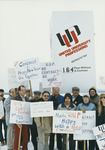 <span itemprop="name">Unidentified people holding signs during a protest...</span>