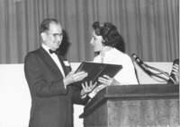 <span itemprop="name">A photograph of Dr. C Luther Andrews receiving...</span>