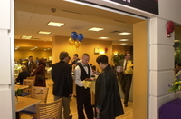 <span itemprop="name">Guests sample treats at the grand opening of...</span>