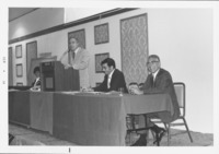 <span itemprop="name">An unidentified man speaking from a podium during...</span>