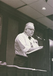 <span itemprop="name">Harold Cannon speaking from a podium during a...</span>