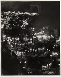 <span itemprop="name">A night-time scene filled with candles and people...</span>