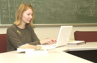 <span itemprop="name">An unidentified woman in a classroom in the School...</span>