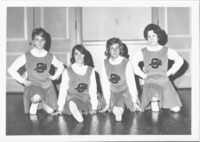 <span itemprop="name">A group portrait of unidentified cheerleaders of...</span>
