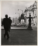 <span itemprop="name">A traffic guard with cars and men walking next to...</span>