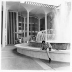 <span itemprop="name">An unidentified male sitting by the fountain...</span>