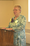 <span itemprop="name">Annette DeLyser '49 speaks at the podium during a...</span>