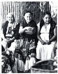 <span itemprop="name">One woman sitting next to two older women, all in...</span>