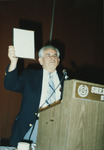<span itemprop="name">Sam Wakshull speaking and holding a plaque during...</span>