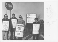 <span itemprop="name">Four unidentified people holding signs and...</span>