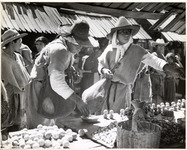 <span itemprop="name">Two men in tunics and hats at a stall in San...</span>