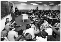 <span itemprop="name">A large group of unidentified students sitting at...</span>