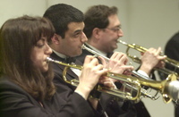 <span itemprop="name">Musicians rehearse for an orchestral performance...</span>