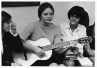 <span itemprop="name">An unidentified female student playing the guitar....</span>