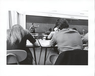 <span itemprop="name">View of an instructor lecturing in front of a...</span>