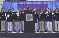 <span itemprop="name">A University at Albany singing group at a peace...</span>