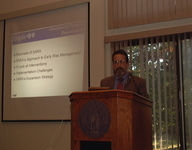 <span itemprop="name">Dr. Alan Sokolow addresses guests at a seminar...</span>