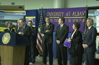 <span itemprop="name">Unidentified person speaking at the press...</span>