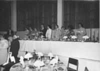 <span itemprop="name">Alumni and university administrators on the dais...</span>