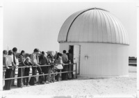 <span itemprop="name">A picture of visitors waiting in line to tour the...</span>