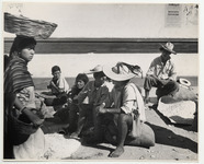<span itemprop="name">A group of vendors, some sitting on large sacks....</span>