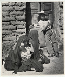 <span itemprop="name">A boy leaning against a wooden door, next to him...</span>