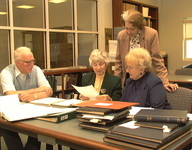 <span itemprop="name">Alumni Affairs: 9/27/00 @ 10 AM New Library Archives room Group of four alumni working on Veteran's Project digital image</span>
