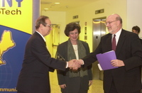 <span itemprop="name">Carl Rosner shakes hands with an unidentified...</span>