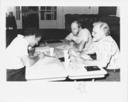 <span itemprop="name">Chuck Rogers (center) and unidentified people...</span>