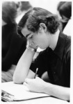 <span itemprop="name">An unidentified male student taking notes in a...</span>