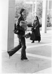 <span itemprop="name">An unidentified student and a woman dressed in a...</span>