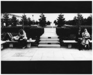 <span itemprop="name">Two unidentified couples sitting on benches in the...</span>