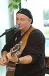 <span itemprop="name">Photo of a guitar player at the grand opening of...</span>