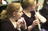 <span itemprop="name">Flautists rehearse for an orchestral performance...</span>