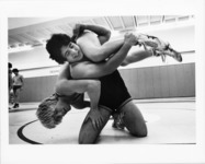 <span itemprop="name">Two wrestlers engaged in a practice match at the...</span>
