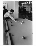 <span itemprop="name">A picture of a student playing a game of pool in...</span>
