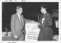 <span itemprop="name">John M. "Tim" Reilly and an unidentified woman...</span>