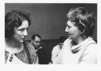 <span itemprop="name">Two unidentified women attending an event...</span>