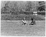 <span itemprop="name">Two unidentified students sitting on the grass...</span>