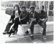 <span itemprop="name">Four unidentified students sitting on the Academic...</span>