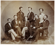 <span itemprop="name">A sepia-toned portrait of eight unidentified male...</span>